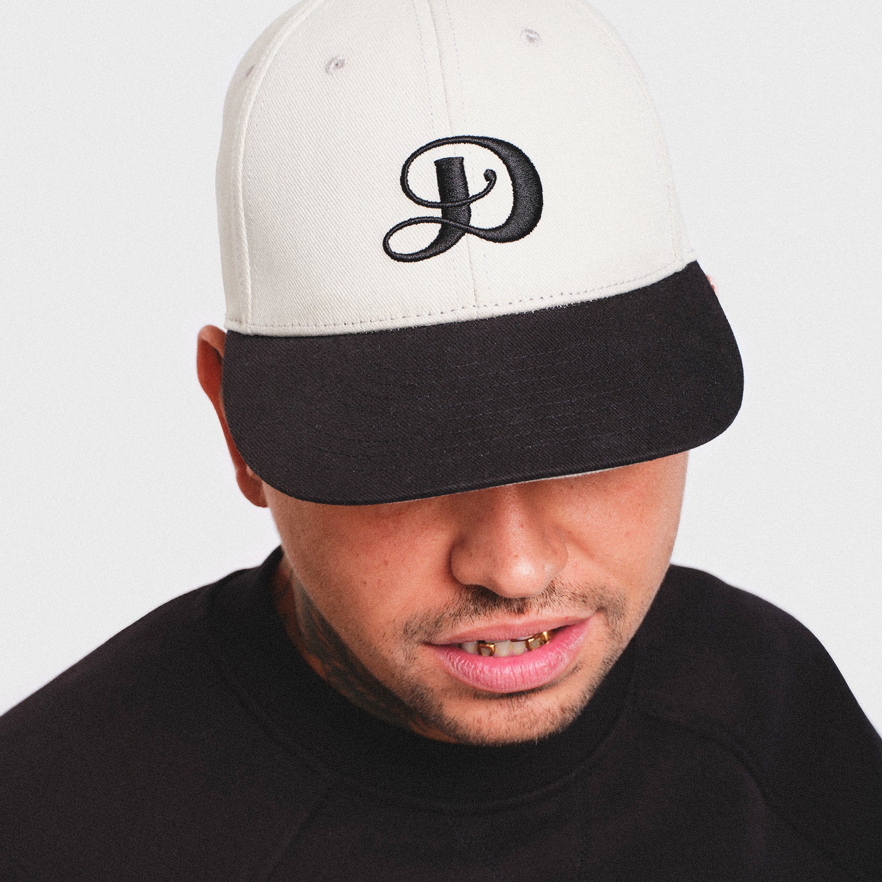 Putty light gray bone white black baseball cap hat SnapBack Damiano embroidered logo high quality clothing luxury streetwear New York City Man model tattoos gold grills