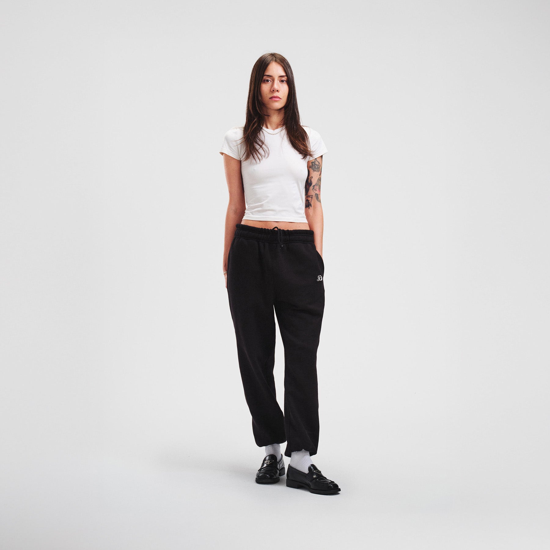 woman model tattoos thin black sweatpants joggers high quality luxury streetwear new york city nyc damiano clothing