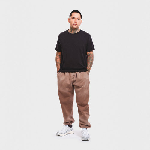 Vintage mineral enzyme wash mocha brown sweatpants joggers sweats high quality cotton men’s luxury streetwear fashion style Damiano clothing Man model tattoo smith street Brooklyn New York City asics
