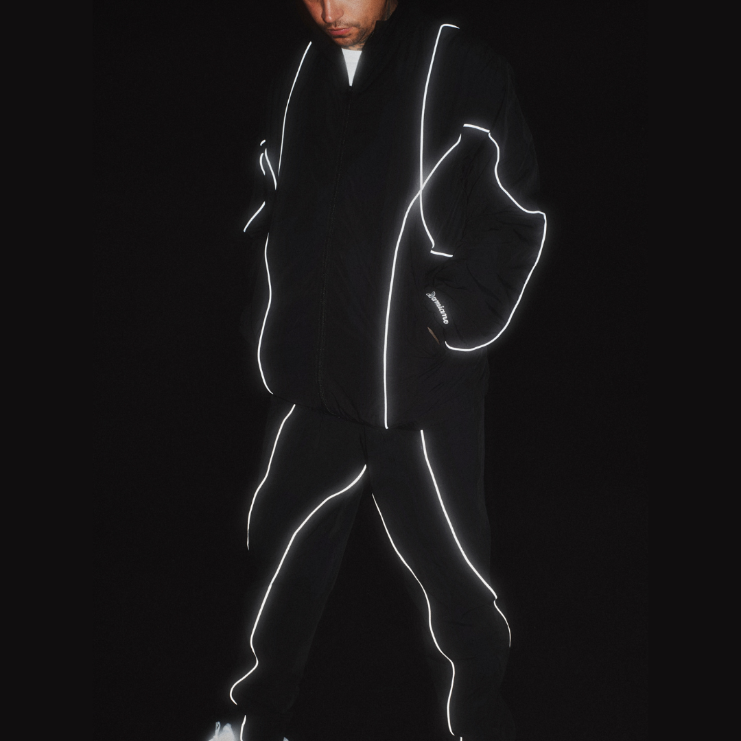 man model tattoos black track jacket pants tracksuit 3M reflective luxury streetwear damiano clothing new york city